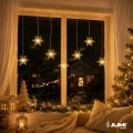 lampki-led-gwiazdki-okno-salon.webp