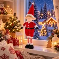 elf-swiateczny-chlopiec-okno-zimowy-krajobraz-dekoracje.webp